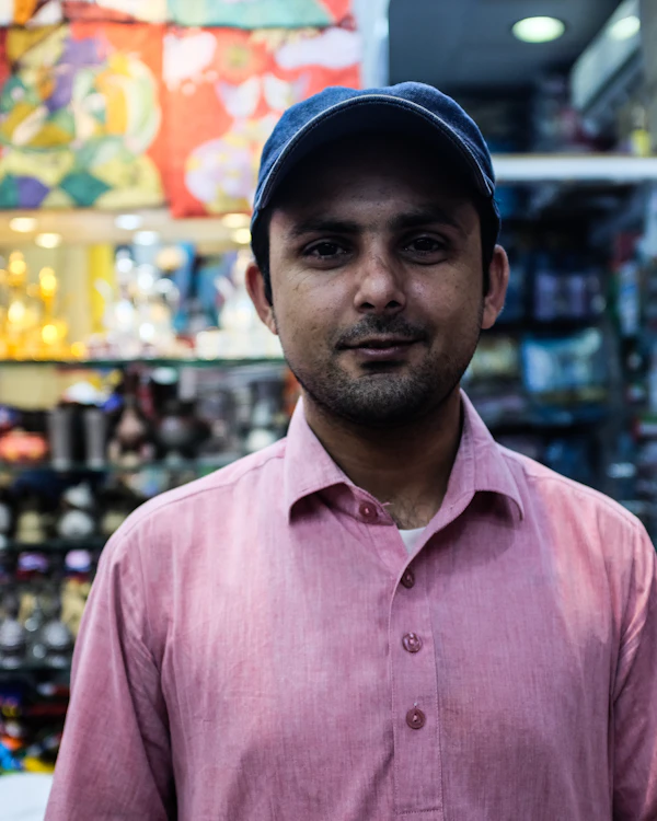 Shop owner standing in his clothing shop